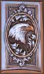 The head and tailfeathers are inlaid platinum.  The beak, talons, and eye of the eagle are of 24k gold.