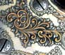 Detail of raised gold scroll inlay on a Remington-Hepburn Single Shot rifle.